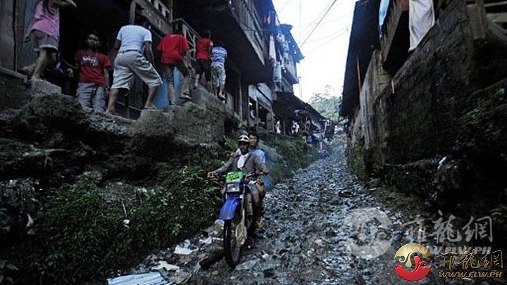 Mining-MtDiwata-motorcycledriver-along-rocky--road-at-village-2012July-AFP.jpg