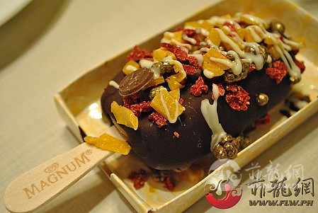 normal_Chocolate_truffle_Magnum_dipped_in_dark_chocolate_and_topped_with_dried_m.jpg