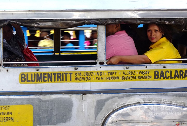 woman-jeepney-window-street-manila-philippines-looking-s.jpg
